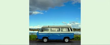 Movie still from “Ingrid Goes West” (2017), directed by Matt Spicer – A blue and white van parked on the side of the road; Wide shot, Low angle
