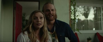 Movie still from “Ingrid Goes West” (2017), directed by Matt Spicer – A man and a woman standing next to each other; Close Up shot, Over the shoulder angle