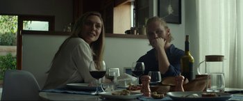 Movie still from “Ingrid Goes West” (2017), directed by Matt Spicer – A man and a woman sitting at a table with wine glasses; Medium shot, Over the shoulder angle