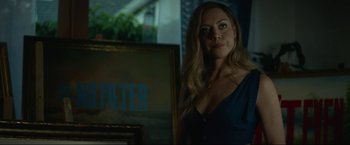 Movie still from “Ingrid Goes West” (2017), directed by Matt Spicer – A woman standing in front of a mirror in a room; Medium shot, Low angle