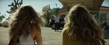 Movie still from “Ingrid Goes West” (2017), directed by Matt Spicer – A man standing on the side of the road in front of two women; Wide shot, Over the shoulder angle