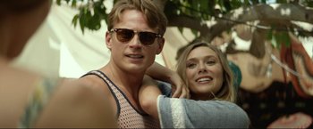 Movie still from “Ingrid Goes West” (2017), directed by Matt Spicer – A man and a woman posing for a picture; Close Up shot, Low angle