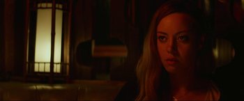 Movie still from “Ingrid Goes West” (2017), directed by Matt Spicer – A beautiful young woman with long blonde hair and green eyes; Close Up shot, Over the shoulder angle