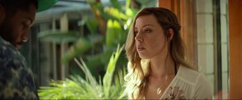 Movie still from “Ingrid Goes West” (2017), directed by Matt Spicer – A beautiful young lady looking off into the distance; Close Up shot, Over the shoulder angle