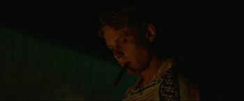 Movie still from “Ingrid Goes West” (2017), directed by Matt Spicer – A man is smoking a cigarette in the dark; Close Up shot, Low angle