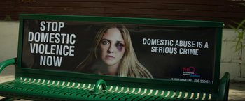 Movie still from “Ingrid Goes West” (2017), directed by Matt Spicer – A billboard with a picture of a woman's face on top of it; Extreme Close Up shot, High angle