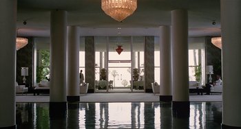 Movie still from “Inherent Vice” (2014), directed by Paul Thomas Anderson – A room filled with lots of pillars and a chandelier; Extreme Wide shot, Low angle