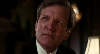 Movie still from “Inherent Vice” (2014), directed by Paul Thomas Anderson – A person wearing a suit and tie; Close Up shot, Low angle