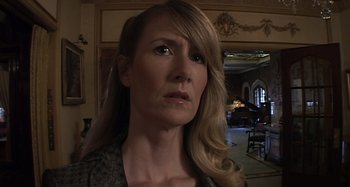 Movie still from “Inland Empire” (2006), directed by David Lynch – A person with long blonde hair; Close Up shot, Low angle