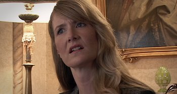 Movie still from “Inland Empire” (2006), directed by David Lynch – A person with long blonde hair; Close Up shot, Over the shoulder angle