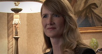 Movie still from “Inland Empire” (2006), directed by David Lynch – A person with long blonde hair; Close Up shot, Over the shoulder angle