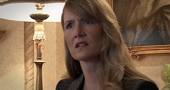 Movie still from “Inland Empire” (2006), directed by David Lynch – A person with long blonde hair; Close Up shot, Over the shoulder angle