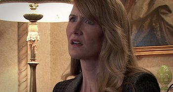 Movie still from “Inland Empire” (2006), directed by David Lynch – A person with long blonde hair; Close Up shot, Over the shoulder angle