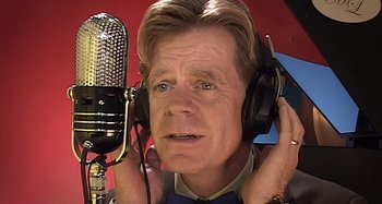 Movie still from “Inland Empire” (2006), directed by David Lynch – A person wearing headphones and a microphone; Close Up shot, Low angle
