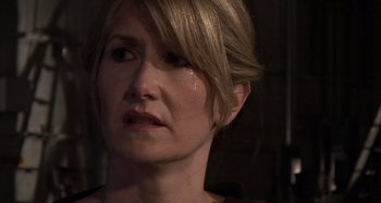 Movie still from “Inland Empire” (2006), directed by David Lynch – A person with a tear in her eye; Close Up shot, Over the shoulder angle