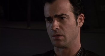 Movie still from “Inland Empire” (2006), directed by David Lynch – A man's face in a dark room; Close Up shot, Over the shoulder angle