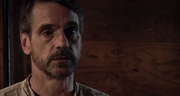 Movie still from “Inland Empire” (2006), directed by David Lynch – A person wearing a shirt; Close Up shot, Over the shoulder angle