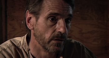 Movie still from “Inland Empire” (2006), directed by David Lynch – A person with a beard; Close Up shot, Over the shoulder angle