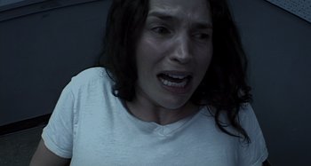 Movie still from “Inland Empire” (2006), directed by David Lynch – A person with her mouth wide open; Close Up shot, Overhead angle