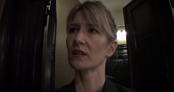 Movie still from “Inland Empire” (2006), directed by David Lynch – A person looking at the camera; Close Up shot, Low angle
