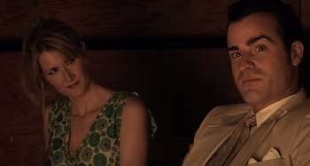Movie still from “Inland Empire” (2006), directed by David Lynch – A man and a woman sitting next to each other; Close Up shot, Over the shoulder angle