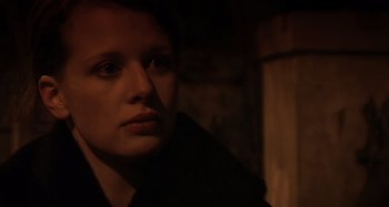 Movie still from “Inland Empire” (2006), directed by David Lynch – A person in a dark room; Close Up shot, Low angle