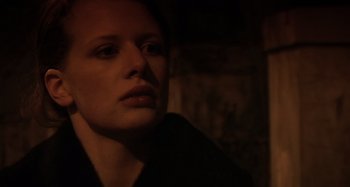 Movie still from “Inland Empire” (2006), directed by David Lynch – A person looking at the camera; Close Up shot, Low angle