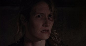 Movie still from “Inland Empire” (2006), directed by David Lynch – A person looking at the camera; Close Up shot, Over the shoulder angle