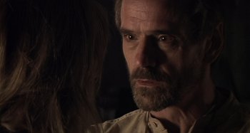 Movie still from “Inland Empire” (2006), directed by David Lynch – A person with a beard; Close Up shot, Over the shoulder angle