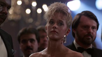 Movie still from “Innerspace” (1987), directed by Joe Dante – A person wearing a dress; Close Up shot, Low angle