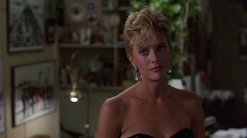 Movie still from “Innerspace” (1987), directed by Joe Dante – A person with short hair; Close Up shot, Over the shoulder angle