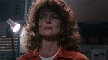Movie still from “Innerspace” (1987), directed by Joe Dante – A person with long hair; Close Up shot, Low angle