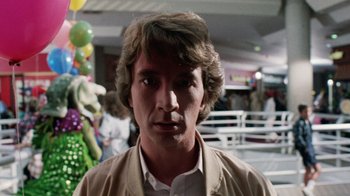 Movie still from “Innerspace” (1987), directed by Joe Dante – A person wearing a jacket; Close Up shot, Low angle