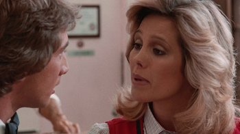 Movie still from “Innerspace” (1987), directed by Joe Dante – A man and a woman talking to each other; Close Up shot, Over the shoulder angle