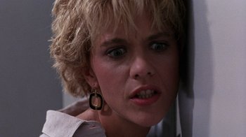 Movie still from “Innerspace” (1987), directed by Joe Dante – A person with short hair; Close Up shot, Low angle