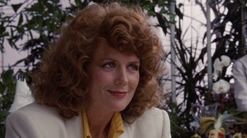 Movie still from “Innerspace” (1987), directed by Joe Dante – A person with curly hair; Close Up shot, Low angle