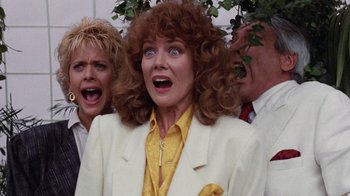 Movie still from “Innerspace” (1987), directed by Joe Dante – A group of people standing next to each other; Close Up shot, Low angle