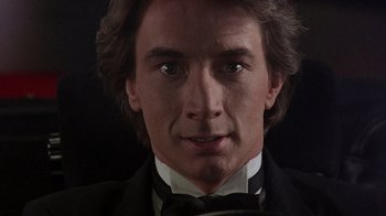 Movie still from “Innerspace” (1987), directed by Joe Dante – A person wearing a tuxedo; Close Up shot, Low angle