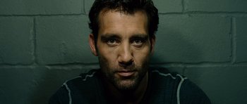 Movie still from “Inside Man” (2006), directed by Spike Lee – A person with a beard; Close Up shot, Low angle