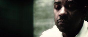 Movie still from “Inside Man” (2006), directed by Spike Lee – A person with a beard and mustache; Close Up shot, Low angle