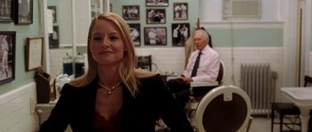 Movie still from “Inside Man” (2006), directed by Spike Lee – A woman in a black jacket and a man in a white shirt; Medium shot, Over the shoulder angle