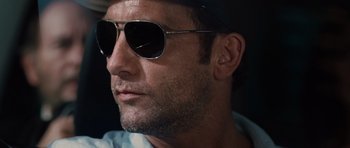 Movie still from “Inside Man” (2006), directed by Spike Lee – A person wearing sunglasses and a hat; Close Up shot, Low angle
