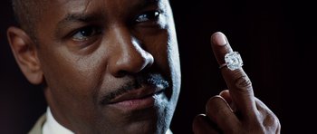 Movie still from “Inside Man” (2006), directed by Spike Lee – A person holding a ring; Extreme Close Up shot, High angle