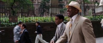 Movie still from “Inside Man” (2006), directed by Spike Lee – A group of men walking down a sidewalk; Medium shot, Over the shoulder angle