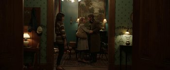 Movie still from “Insidious: Chapter 2” (2013), directed by James Wan – Two women and a man standing in front of a painting; Wide shot, Over the shoulder angle