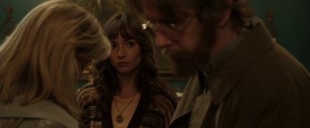 Movie still from “Insidious: Chapter 2” (2013), directed by James Wan – A woman in a brown jacket and a man in glasses; Close Up shot, Over the shoulder angle