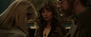 Movie still from “Insidious: Chapter 2” (2013), directed by James Wan – A person wearing a necklace; Close Up shot, Over the shoulder angle