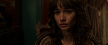 Movie still from “Insidious: Chapter 2” (2013), directed by James Wan – A person with long curly hair; Close Up shot, Over the shoulder angle