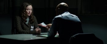 Movie still from “Insidious: Chapter 2” (2013), directed by James Wan – A man and a woman are sitting at a table talking; Medium shot, Over the shoulder angle