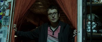 Movie still from “Insidious: Chapter 2” (2013), directed by James Wan – A young man wearing glasses and a black jacket; Close Up shot, Low angle